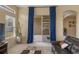 Comfortable living room with large windows, stylish curtains, and a seamless transition to the outdoor patio at 5062 Otters Den Trl, Sanford, FL 32771