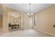 Neutral living room with archway, window, light carpet, and entrance to the foyer at 5062 Otters Den Trl, Sanford, FL 32771