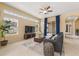 Spacious living room with high ceilings, large windows, and a comfortable seating area at 5062 Otters Den Trl, Sanford, FL 32771