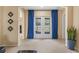 Cozy living room with light-colored carpet, blue drapes, and open doorways to adjacent rooms at 5062 Otters Den Trl, Sanford, FL 32771