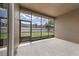 Enclosed lanai offering view of the green backyard at 5062 Otters Den Trl, Sanford, FL 32771