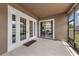 Covered patio featuring french doors and an additional sliding door at 5062 Otters Den Trl, Sanford, FL 32771