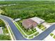 Drone shot of the property showing its desirable neighborhood and proximity to green spaces at 613 Crownclover Ave, Orlando, FL 32828