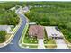 Beautiful aerial view of a well-maintained home with a lush green lawn and mature trees at 613 Crownclover Ave, Orlando, FL 32828