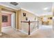 Bright upstairs hallway featuring neutral paint, white trim, and stylish railing accents at 613 Crownclover Ave, Orlando, FL 32828