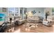 Comfortable living room with hardwood floors, an area rug, and plenty of seating, perfect for relaxation and entertainment at 613 Crownclover Ave, Orlando, FL 32828
