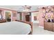Spacious main bedroom with neutral carpet, a ceiling fan, and an ensuite bathroom at 613 Crownclover Ave, Orlando, FL 32828