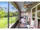 Enclosed patio featuring neutral furniture with views of backyard at 613 Crownclover Ave, Orlando, FL 32828