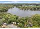 Scenic aerial view showcasing the property's serene lakefront setting surrounded by lush greenery at 613 Lake Ave, Altamonte Springs, FL 32701