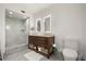 This bathroom features patterned tile floors, a glass-enclosed shower, and double sinks at 613 Lake Ave, Altamonte Springs, FL 32701