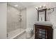 This bathroom features patterned tile floors, a glass-enclosed shower, and updated fixtures at 613 Lake Ave, Altamonte Springs, FL 32701