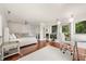 Bright bedroom with closet, hardwood floors, and a work area at 613 Lake Ave, Altamonte Springs, FL 32701
