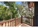 A view from the wood deck of a property with mature trees and Spanish moss overlooking a tranquil water view at 613 Lake Ave, Altamonte Springs, FL 32701