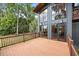 Exterior view featuring a spacious deck and striking architecture with expansive windows at 613 Lake Ave, Altamonte Springs, FL 32701