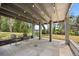 Outdoor patio space with stylish seating and serene views of lush greenery and waterfront at 613 Lake Ave, Altamonte Springs, FL 32701