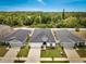 Aerial view of a well-maintained home with landscaped yard, nestled in a serene neighborhood at 62 Polermo Ave, St Cloud, FL 34771