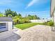 Backyard featuring a paver patio, lush lawn, and privacy fencing at 62 Polermo Ave, St Cloud, FL 34771