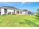 Spacious backyard with well-maintained lawn and patio, perfect for outdoor enjoyment at 62 Polermo Ave, St Cloud, FL 34771