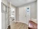 Inviting foyer with wood flooring, neutral paint, and a view into the bedroom at 62 Polermo Ave, St Cloud, FL 34771