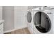 Convenient laundry room featuring modern washer and dryer units at 62 Polermo Ave, St Cloud, FL 34771