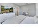 Comfortable main bedroom showcasing a large TV, dresser, and writing desk area at 62 Polermo Ave, St Cloud, FL 34771