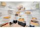 Large walk-in pantry with ample shelving space for storage at 62 Polermo Ave, St Cloud, FL 34771