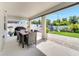 Covered patio area with an outdoor dining table overlooking the backyard at 62 Polermo Ave, St Cloud, FL 34771