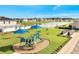 Picturesque playground near a tranquil lake with park benches, offering a serene and recreational atmosphere at 62 Polermo Ave, St Cloud, FL 34771