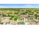 Stunning aerial view of a residential area with neatly arranged homes, vibrant greenery, and a friendly neighborhood vibe at 7025 Hiawassee Oak Dr, Orlando, FL 32818