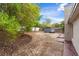 Large backyard features a shed, trees, and ample space for outdoor activities at 7025 Hiawassee Oak Dr, Orlando, FL 32818