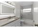 Bathroom featuring a vanity with a tub/shower combination at 7025 Hiawassee Oak Dr, Orlando, FL 32818