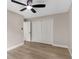 Bedroom with a ceiling fan and closet at 7025 Hiawassee Oak Dr, Orlando, FL 32818