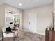 This entryway leads into a spacious living room that features hardwood floors and neutral colored walls at 7025 Hiawassee Oak Dr, Orlando, FL 32818