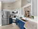 Modern kitchen with stainless steel appliances, granite countertops, white subway tile backsplash, and modern cabinets at 7025 Hiawassee Oak Dr, Orlando, FL 32818