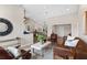 Open concept living area with views into the updated kitchen and dining room, featuring a modern design at 7025 Hiawassee Oak Dr, Orlando, FL 32818