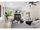 Charming living room features a fireplace, lots of light and modern furnishings at 7025 Hiawassee Oak Dr, Orlando, FL 32818
