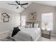 Bright main bedroom with a vaulted ceiling, fan, and neutral tones at 7025 Hiawassee Oak Dr, Orlando, FL 32818