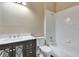 Bathroom with a single sink vanity and bathtub/shower combo at 709 Strihal Loop, Oakland, FL 34787