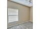 A bedroom featuring a ceiling fan and a large window at 709 Strihal Loop, Oakland, FL 34787