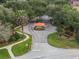Gated community entrance with lush landscaping, creating an exclusive and welcoming atmosphere at 709 Strihal Loop, Oakland, FL 34787