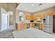 Well-appointed kitchen features stainless steel appliances, tile floors, and ample counter space at 709 Strihal Loop, Oakland, FL 34787