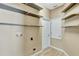 Laundry room with overhead shelving and washer hookups at 709 Strihal Loop, Oakland, FL 34787