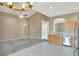 Spacious living area with modern fixtures and views of the kitchen area at 709 Strihal Loop, Oakland, FL 34787