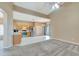 Open-concept living room flows into a modern kitchen with stainless steel appliances at 709 Strihal Loop, Oakland, FL 34787