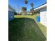 View of spacious green backyard and beautiful palm trees at 73 Brooks Dr, Ormond Beach, FL 32176