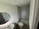 Bathroom featuring walk-in shower with tile surround, modern fixtures, and hardwood floors at 73 Brooks Dr, Ormond Beach, FL 32176