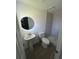 Bathroom featuring walk-in shower with tile surround, modern fixtures, and hardwood floors at 73 Brooks Dr, Ormond Beach, FL 32176