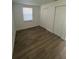 Bedroom with hardwood floors, closet space and natural light from the window at 73 Brooks Dr, Ormond Beach, FL 32176