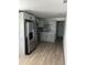 Modern kitchen features gray cabinets, stainless steel appliances, and stylish backsplash at 73 Brooks Dr, Ormond Beach, FL 32176