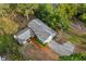 Aerial view of a lovely two-story home with a gray roof, green bushes, and a long concrete driveway at 7470 Lake Marsha Dr, Orlando, FL 32819